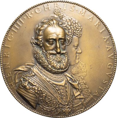 a close up of a coin with a man in a crown on it
