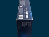 a box of toothbrushes sitting on a blue surface