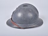a helmet that is sitting on a white surface