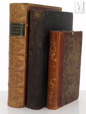 three books that are sitting on a white table