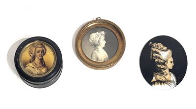 three framed portraits of women and men are displayed on a white surface