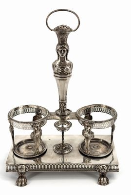 an image of a silver plate with three cups and a candle holder