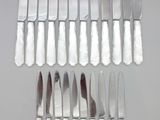 a lot of knives that are sitting on a table