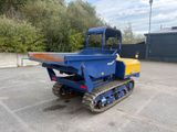 an image of a blue and yellow machine parked in a parking lot