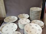 a lot of plates that are sitting on a table