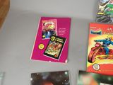 many books on the table with pictures on them