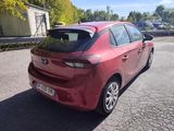 a picture of a red car parked in a parking lot