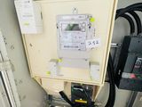 an electrical panel with wires and wires attached to it