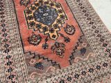 a rug on the floor with a blue and red design