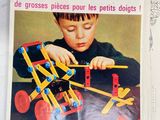 two magazines on the table with a child playing with them