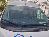 a white van that is parked in a parking lot
