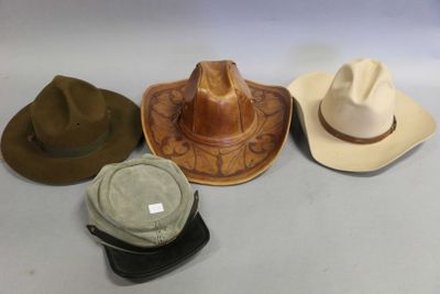several different hats are lined up on a white surface