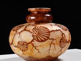 a vase that is sitting on a white table