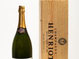 an image of a bottle of champagne next to a wooden box