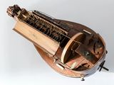 a model of a musical instrument on a white surface