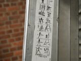 a sticker on the door of a building that has a drawing on it