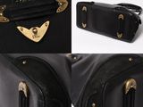 a collage of photos of a black suitcase with gold hardware