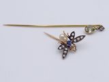 an image of a bee broocher with a pearl and diamond broocher