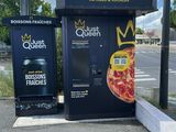 two vending machines on the side of the road