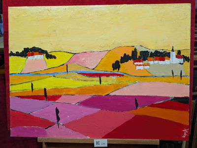un tableau posé sur un chevalet représentant un paysage