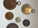 a lot of coins that are on the table