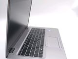 a close up of a laptop computer on a white surface