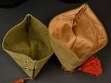 two hats that are sitting on a table