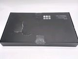 a black box that is open on a white surface