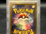 a close up of a pokemon card in a clear box