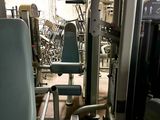 an image of a gym room with equipment in it
