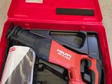 a red tool box with tools in it on the floor