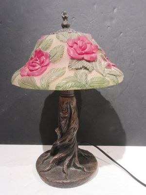 a lamp that is sitting on a table next to a wall