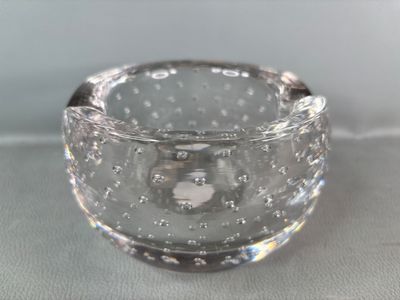 a clear glass bowl with bubbles in it on a table
