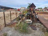 a pile of junk sitting in the middle of a field