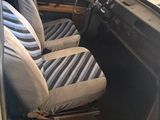 a car that is sitting in the garage with its door open