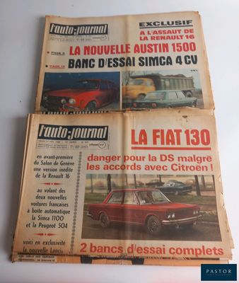 three old french newspapers sitting on top of each other on a table