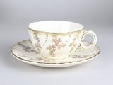 tea cup and saucer with a floral design on a saucer