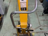 a yellow machine that is sitting on the floor