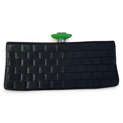 black leather wallet with a green button on top of it