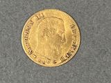 l'image d'une pièce d'or sur laquelle figure le visage d'un homme