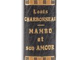 un gros plan sur un livre noir orné de lettres dorées