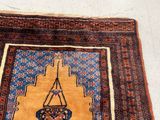 a rug on the floor with a hanging basket on top of it
