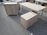 several desks and chairs in a room that is empty
