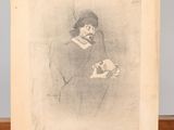 an old picture of a woman holding a cat on a wooden table