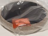 a plastic bag with a black and orange object in it