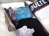 a pile of pillows and other items in a box