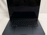 an open laptop computer sitting on top of a white surface