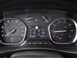 a close up of a car dashboard with various gauges
