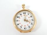 an image of a gold pocket watch with a white face and numbers on the face
