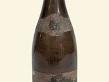 a bottle of wine that is sitting on a table